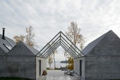 an open air building with three triangular shaped windows on the front and back of it