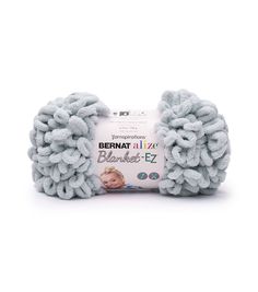 the bernat baby blanket is light blue and has been made with yarn in it