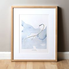 a watercolor painting of a bird sitting on top of a tree branch in front of a wall