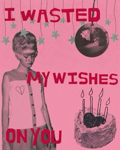 a woman standing in front of a cake with candles on it and the words i wasted my wishes on you