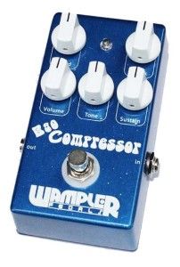 a blue and white guitar pedal sitting on top of a table