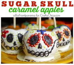 sugar skull caramel apples on a plate with the words sugar skull caramel apples