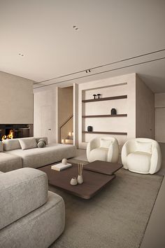 a living room filled with white furniture and a fire place in the fireplace behind it