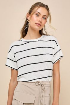 Create an OOTD that's casually compliment-worthy with the Lulus Laid-Back Perfection White Striped Knit Short Sleeve Top! Soft, lightweight sweater knit, with a black striped design throughout, shapes this effortless top with a classic crew neckline framed by short sleeves. The relaxed, boxy bodice creates the ideal, breezy day 'fit! Fit: This garment fits true to size. Length: Size medium measures 21.5" from shoulder to hem. Bust: Great for any cup size. Waist: Not Fitted - comfortable room thr Striped Textured Knit Top For Layering, Trendy Striped Crew Neck Knit Top, Striped Knit Crew Neck Top, Fine Knit Striped Tops For Spring, Striped Fine Knit Crew Neck Top, Chic Striped Crew Neck Knit Top, Striped Textured Knit Crew Neck Top, Crew Neck Pointelle Knit Sweater For Day Out, Ribbed Crew Neck Sweater For Day Out