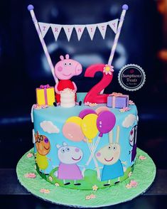 a birthday cake with peppa the pig on top and balloons in the shape of numbers