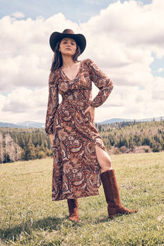 Effortlessly stylish, the Wrangler Paisley Maxi Dress sets the tone for a fall Western-inspired look. A paisley print, flattering v-neck, and peasant sleeve gives all the boho vibes you know and love. Complete the look with a tall cowgirl boot and a Western hat. Mom Uniform, Button Front Maxi Dress, Peasant Sleeve, Dress Sets, Western Hat, Paisley Maxi Dress, Fall Wedding Guest Dress