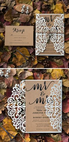 the wedding stationery is laid out on top of leaves and has an intricate laser cut design