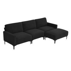 a black couch sitting on top of a white floor