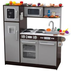 a toy kitchen with an oven, stove and sink