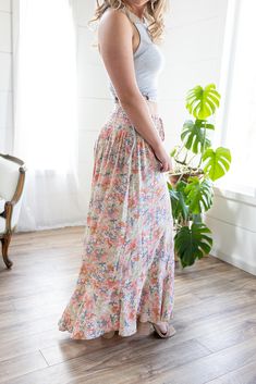 Look no further, our best-selling maxi skirt is here in a fresh new print! The stunning bright floral print, flattering button detail, and a flowy maxi-length is sure to make this your go-to for any summer get-together! Whether you’re heading out on a flirty date night or a daytime gathering, the only thing you’ll be worried about is having too much fun! Features: smocked elastic waist, functional buttons, lined to knee, floral print, open in front, long length Color: Blush Mix100% RayonFor full care instructions, please refer to the manufacturer's label. Fit: True to size.Length: Hits at the ankle on most -- 42” in total lengthWaist: Stretchy with elastic waistbandHips: Relaxed with give Models are wearing size Medium and Small respectively. MODEL INFO Ashley Brook Height: 5'3" Height: 5' Play Date, Floral Maxi Skirt, Color Blush, New Print, Floral Maxi, Button Detail, Long Length, Smocking, Date Night