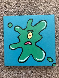 an acrylic painting of a green creature with eyes and mouth on a blue background