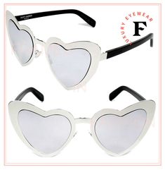 LOULOU 196 COLLECTION Oversized heart-shaped sunglasses. Parisian elegance with a new-age rock-and-roll edge AUTHENTIC BRAND NEW PRODUCT Heart-shaped sunglasses by Saint Laurent Acetate and metal frame branding at temples Fitted with Silver Mirrored lens offering 100% UV400 protection category 2 filter Made in Italy SL 196 LOULOU S Color 001 Size 55-23-145 Accompanied with an original black leather YSL case and a cleaning cloth. Unisex Parisian Elegance, Shaped Sunglasses, Heart Shaped Sunglasses, Heart Sunglasses, Metal Heart, Cleaning Cloth, Cat Eye Sunglasses, Rock And Roll, Sunglasses Accessories