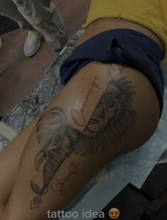 a woman with an elephant tattoo on her thigh