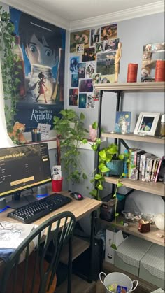 a desk with a computer on top of it next to a book shelf filled with books