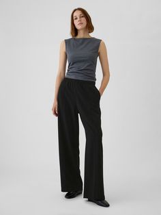 Soft stretch pull-on pants.  Elasticized waist.  Front slant pockets, back welt pockets.  Seam at front and back.  Fit: Classic.  An easy silhouette that fits close  at the waist, and is relaxed through the hips and thigh.  Mid rise.  Models wearing Gap Flattering Pants For Thick Thighs, Grad Outfits, Easy Silhouette, Flattering Pants, Toddler Jeans, Tailored Pants, Pull On Pants, Model Poses, The Gap