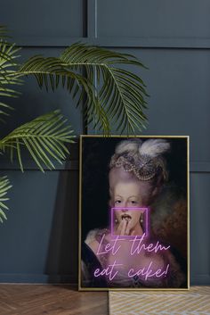 a neon sign that says let them eat cake in front of a potted plant