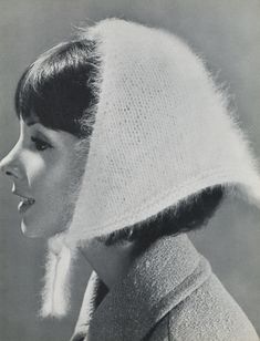 black and white photograph of a woman with a knitted hat on top of her head