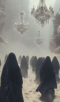 a group of people in black robes walking through a foggy area with chandeliers hanging from the ceiling