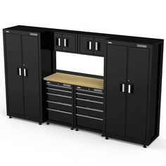 a large black cabinet with drawers and cabinets on the top, next to a workbench