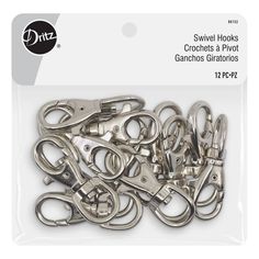 a bunch of silver colored metal hooks on a white background with the words, swivel hooks crochets a hoot ganchos giratos