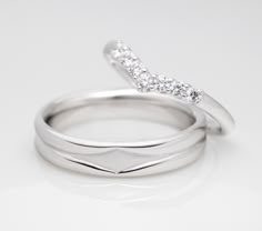 two white gold wedding rings with diamond accents