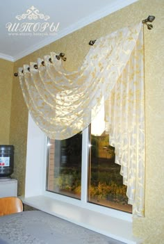 a bed sitting under a window in a bedroom