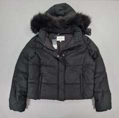 This classic puffer jacket features two zipped side pockets, a press-stud lapped full linear zip closure and a zip detachable hood with added faux fur to the collar for some added comfort. Finished with ribbed cuffs and a modern rubber branded arm patch with fleece lined zipped pockets, the Riley is constructed with recycled fill. This heritage outerwear option is sure to bring comfort, warmth and maximum style, ideal for cold winter months. Condition: New With Tags Size: 18 UK Zip fastening 2 Zip Pockets Removable Hood Removable Faux Fur Long sleeves  Outer: 88% Polyester, 12% Cotton Filling: 100% Polyester Machine Washable Please See The Pictures For Measurements  All orders are posted within 24H Monday- Friday . Expect a fast delivery 🚀 Black Winter Jacket, Faux Fur Hooded Coat, Clothing Wishlist, Jack Wills, Fur Hood, Detachable Hood