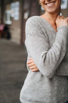 "Madeira pullover, Alpaca wool sweater, Hand knitted pullover, Grey pullover, Silk pullover, V neck sweater, Women Sweater, Winter sweater Making time - 15 days (every pullover is hand knitted * Name: Madeira pullover * Handmade * Colour: light grey * 77 % alpaca wool, 23% silk * Length of the sweater: 62 cm * Length of the sleeve: 62 cm The model is 178 cm height and is wearing size S. Choose your size (your body measurements) : Size XS: US 0-2 / EUR34 / UK 5-6 / AU 5-6 Bust: fits bust around 8 Winter Knit V-neck Sweater, Cozy Merino Wool V-neck Sweater For Winter, Cozy Hand Knitted Alpaca Sweater, Hand Knitted Alpaca Sweater Crew Neck, Gray Knitted V-neck Sweater, Cozy Merino Wool V-neck Sweater, Alpaca Knit Long Sleeve Sweater, Alpaca Wool Sweater, Women Sweaters Winter