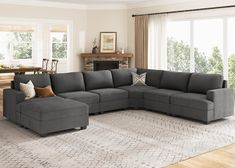 a living room with a large gray sectional couch