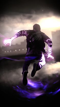 a man is running in the air with his arms out and purple lights shining behind him