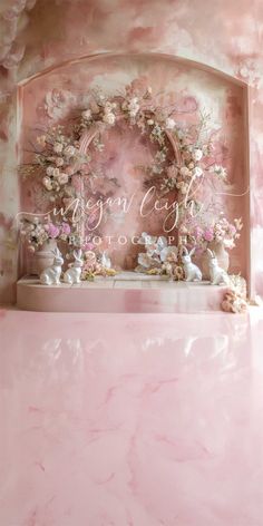 a pink and white wall with flowers on it