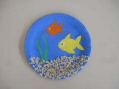 a paper plate that has some fish on it and oats in front of it