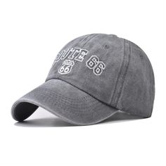 a grey hat with the words coffee on it and white letters in black lettering,