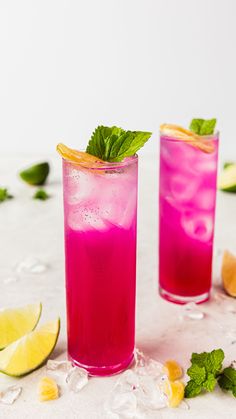 two glasses filled with pink lemonade and mint garnish