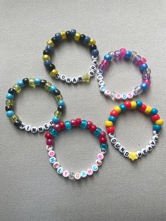 PLEASE READ FULL DESCRIPTION Let's trade friendship bracelets at Conan Gray's Found Heaven on Tour! Unique and high-quality bracelets for you to either wear or share during the concert. Keep what you love and trade what you don't! They're the perfect addition to any Found Heaven tour outfit! Randomly chosen for each order. No duplicates in an order. Customization possible upon request. Customization: let me know your favorite songs, album, phrases, inside jokes, or colors and I'll include a personalized mix for you! Bracelets are approximately between 6.5-7.5 inches but let me know if you would like them smaller or bigger sizes All bracelets are made with pony beads, letter beads and clear stretch cord. Designed for easy trading and swapping, but please be careful when pulling them on or o Concert Beaded Bracelets, Heathers Bracelets, Found Heaven Bracelet, Handmade Inspirational Bracelets For Friendship, Multicolor Inspirational Jewelry For Friendship, Inspirational Multicolor Friendship Jewelry, Customized Multicolor Friendship Jewelry, Customized Multicolor Jewelry For Friendship, Inspirational Multicolor Bracelet Jewelry