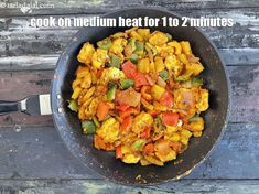 a pan filled with food sitting on top of a wooden table