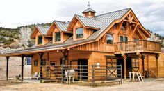 a large wooden house with metal roofing