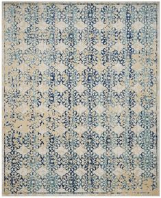 a blue and white rug with an intricate design