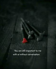 two pencils and a red heart on a wooden table with the words you are still important to me with or without conversation