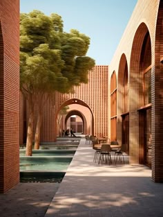 an outdoor courtyard with tables and chairs next to a large brick building that has arches on both sides