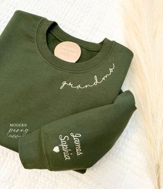 GRANDMA Embroidered sweatshirt, grandma sweatshirt with grandkids name, grandma Crewneck Sweatshirt  Custom grandma Shirt Christmas Gift Perfect gift for mama for Mothers day, moms birthday, baby showers and more! Mama Embroidered sweatshirt, Mama Crewneck Sweatshirt, Pregnancy Reveal Gift for New mom, Custom Mom Shirt with Kids Names, Mama Sweater first picture is military green sweatshirt with #3 thread wording can be changed to: mom, grandma, nana, granny, gigi, mimi, dad, dada,  - please wri Grandma Embroidery Sweatshirt, Grandma Embroidered Sweatshirt, Embroider Knitting, First Time Grandma Gifts, Grandma Christmas Gifts, Grandma Hoodie, Monogram Inspiration, Grandma Crewneck