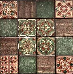 several different colored tiles with designs on them, one is green and the other is red