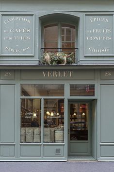 the store front of a building with many windows