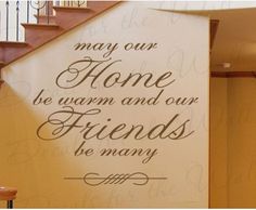 there is a sign that says may our home be warm and our friends be many