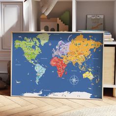 a large map of the world is on display in a child's room