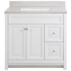 a white bathroom vanity with marble top and drawers