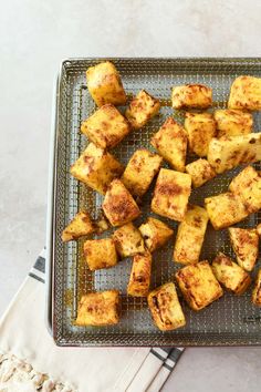 some food is sitting on a cooling rack and ready to be cooked in the oven