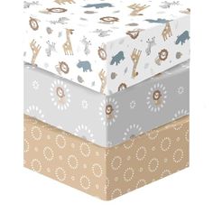 three boxes are stacked on top of each other in different colors and patterns, one with a giraffe design