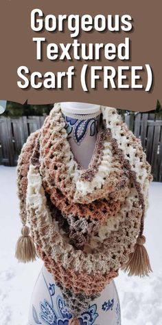 a crocheted scarf with tassels on it and the text, gorgeous textured scarf free