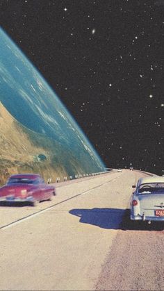 two cars are driving down the road in front of an earth - like area with mountains and stars